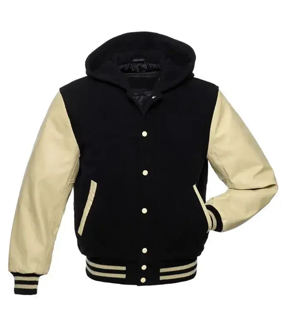 Black and cream hooded varsity jacket front view with baseball jacket styling, snap buttons, and striped waistband finish.