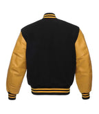 Black and gold varsity jacket with leather sleeves and striped trim, back view