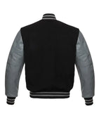 Black varsity jacket with gray leather sleeves and striped cuffs, back view
