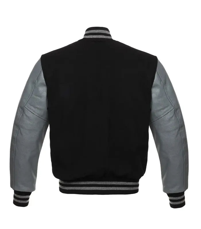 Black varsity jacket with gray leather sleeves and striped cuffs, back view