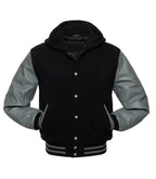 Black and grey letterman hoodie jacket front view with baseball jacket styling, contrast sleeves, and ribbed cuffs.
