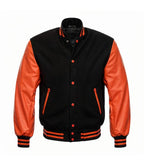 Black and orange varsity jacket with leather sleeves, snap buttons, and striped cuffs