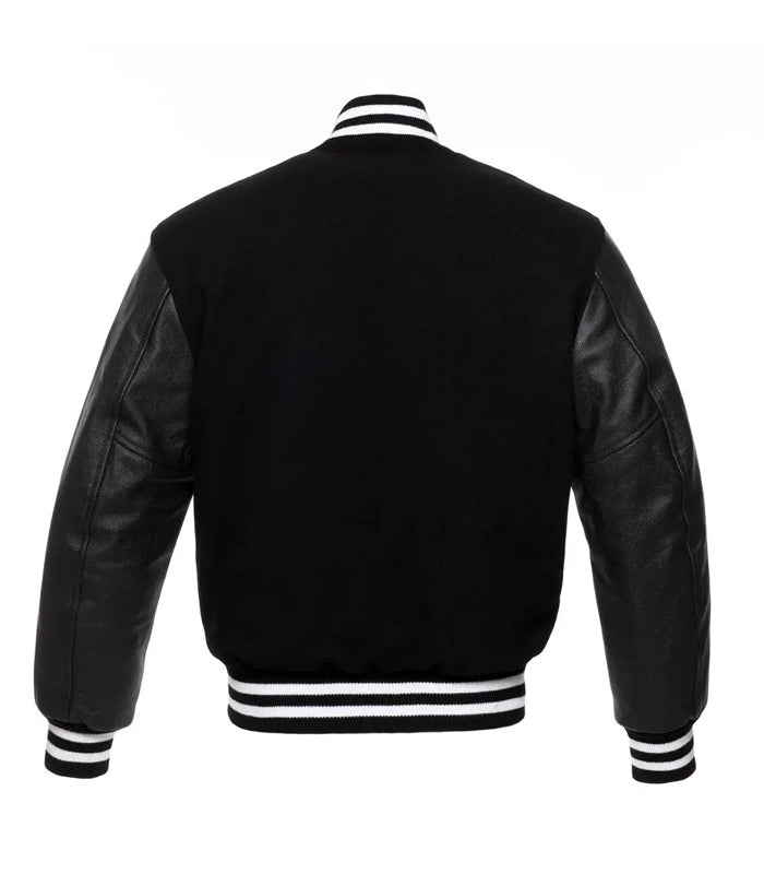 Black varsity jacket with leather sleeves and white striped cuffs and collar, back view
