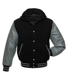 Black and grey hooded varsity jacket front view with snap button closure, letterman style body, and striped ribbed trims.