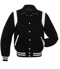 Black and white classic varsity jacket front view with snap button closure, contrast shoulder panels, and striped ribbed hem.