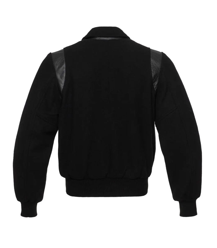 Back view of a monochrome black letterman jacket with a classic fold-down collar and tonal leather shoulder detailing.