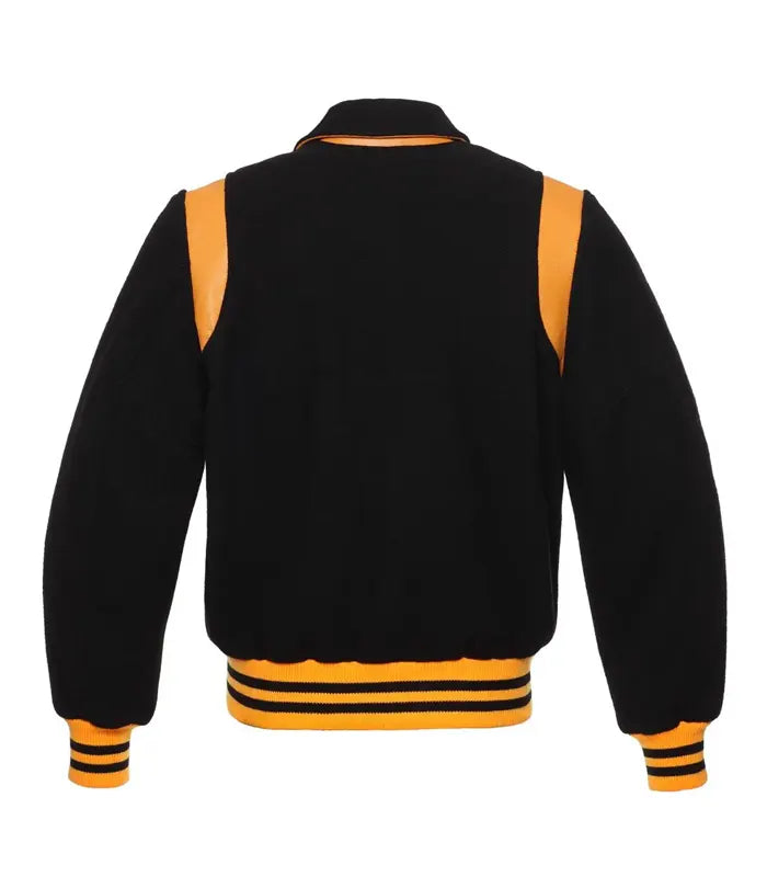 Back view of a black letterman jacket featuring a classic collar, contrasting gold leather shoulder details, and a yellow striped athletic hem.
