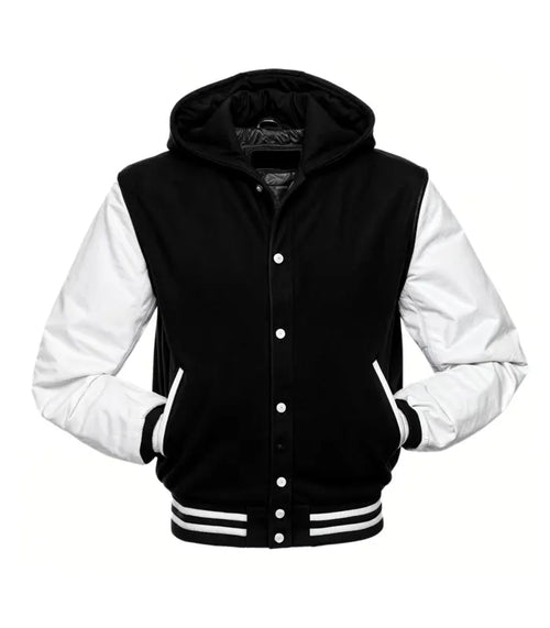 Front view of a black hooded varsity jacket with white leather sleeves, snap-button closure, and striped rib-knit waist and cuffs.