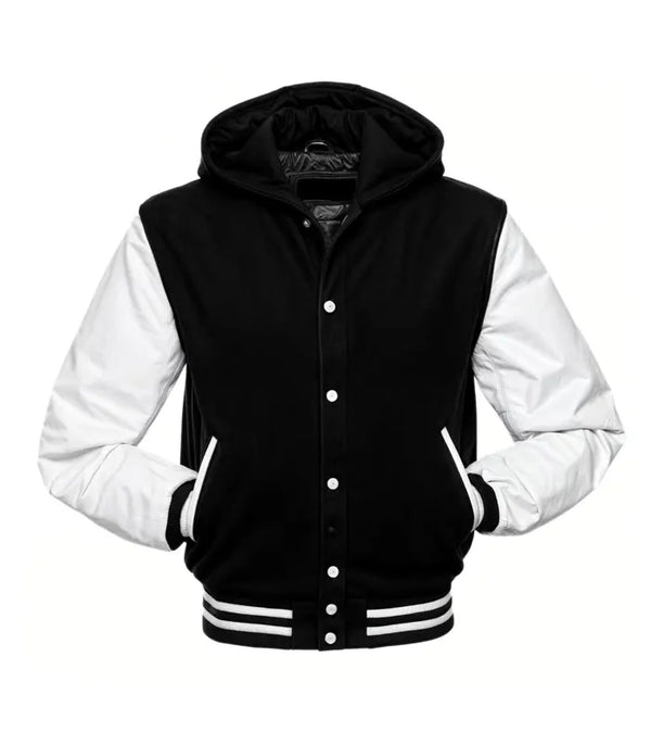 Front view of a black hooded varsity jacket with white leather sleeves, snap-button closure, and striped rib-knit waist and cuffs.