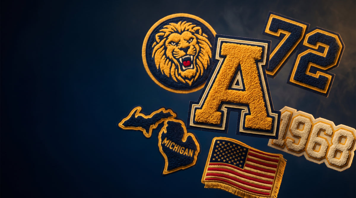 Assorted custom chenille patches for varsity jackets including letter, mascot, number, year, flag, and state designs on a navy background